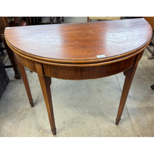 199 - A George III mahogany demi-lune fold over tea table