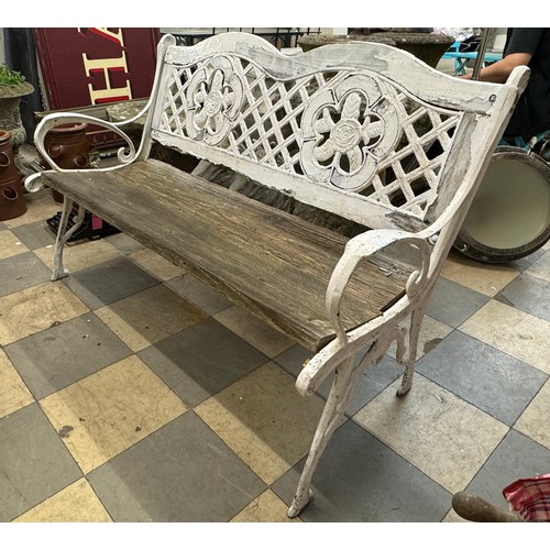 265 - A cast iron and wooden garden bench