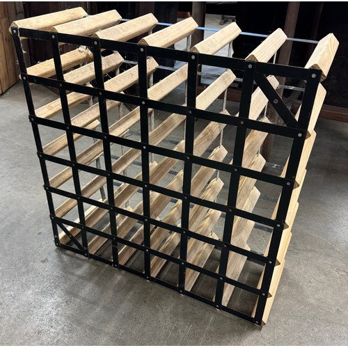 258 - A pine and metal wine rack