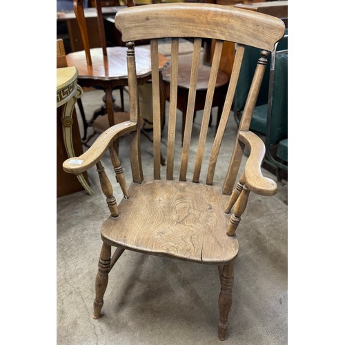 243 - A Victorian elm farmhouse armchair