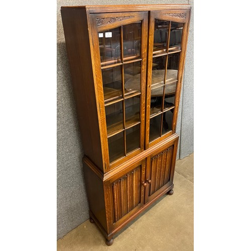 88 - An early 20th Century oak four door bookcase