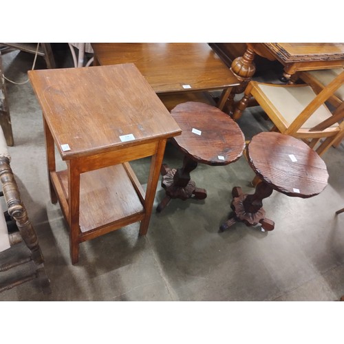 216 - A pair of Spanish carved pine wine tables and an oak occasional table