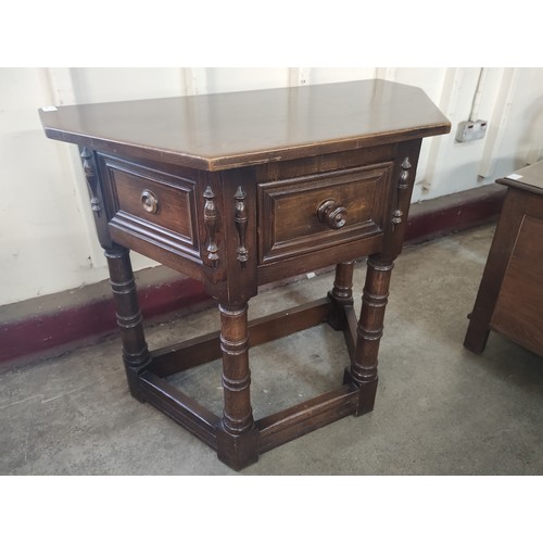 218 - A 17th Century style oak single drawer credence table