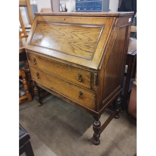 219 - An early 20th Century oak bureau