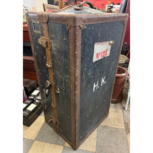 266 - An early 20th Century Innovation metal bound fitted travel trunk