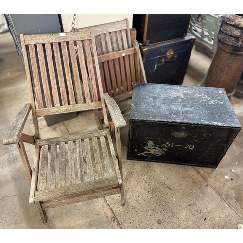 277 - A pair of teak garden chairs and a galvanised Police safe