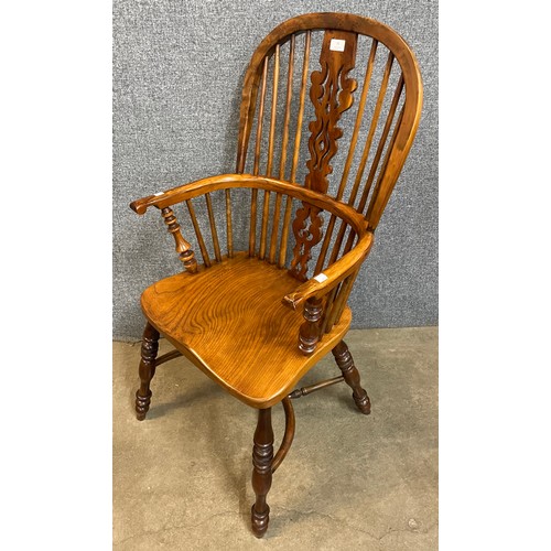 76 - A 19th Century style elm and yew Windsor chair