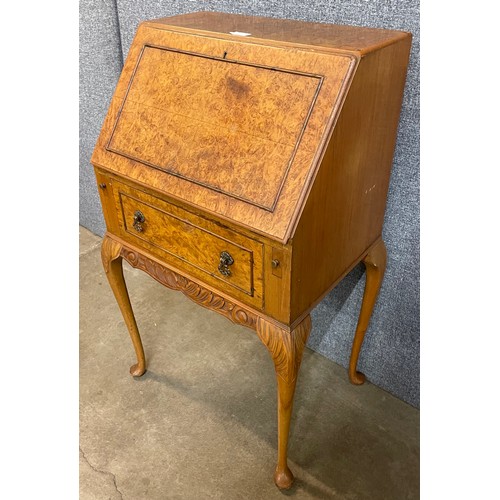 82 - A Queen Anne style burr walnut bureau de dame