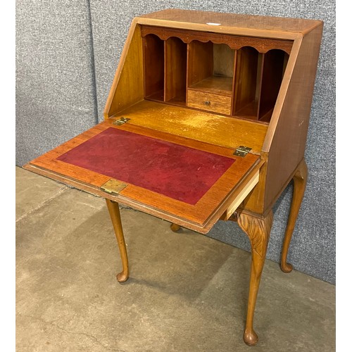 82 - A Queen Anne style burr walnut bureau de dame