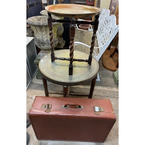 273 - Two Islamic brass topped tables and a faux leather suitcase