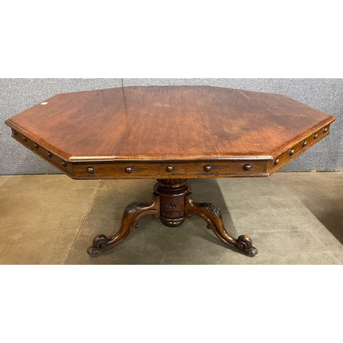 91 - A Victorian carved oak octagonal centre table