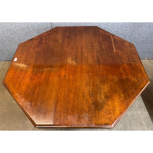 91 - A Victorian carved oak octagonal centre table