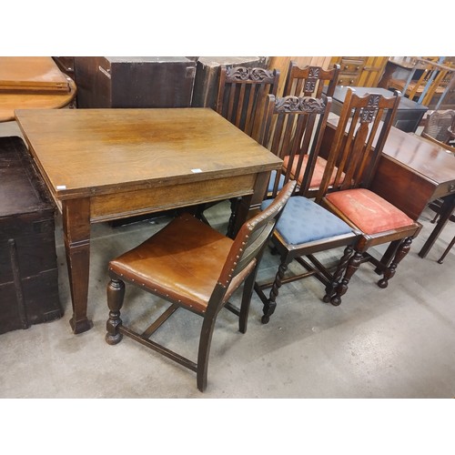 223 - An early 20th Century oak fold over pastry table and five assorted chairs