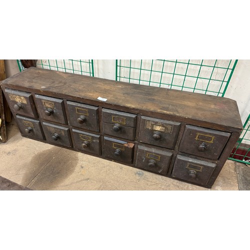 303 - A Victorian pine twelve drawer apothecary cabinet and a Nelsein fitted engineers chest with tools