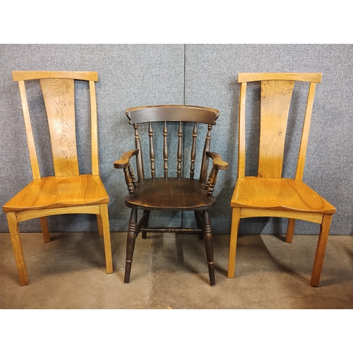 179A - A pair of elm and burr elm Arts and Crafts style chairs and an elm armchair