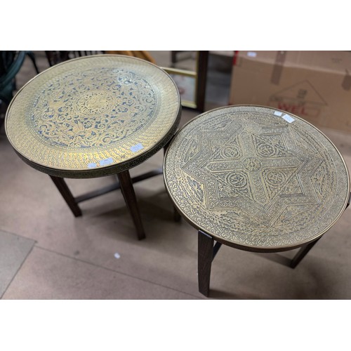 285 - Two Islamic brass topped folding tables