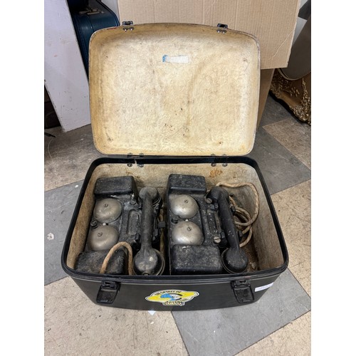 323 - Two field telephones in a hard case