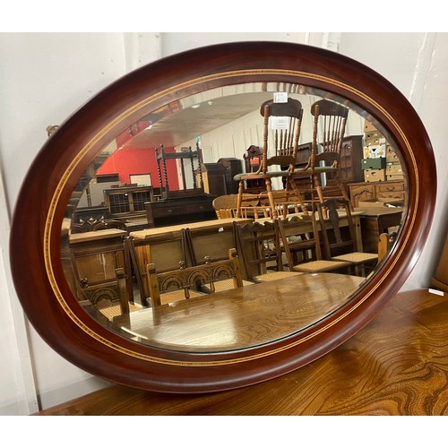 331 - An Edward VII inlaid mahogany framed oval mirror