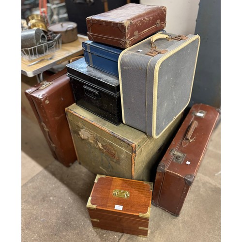 293 - Assorted suitcases and boxes