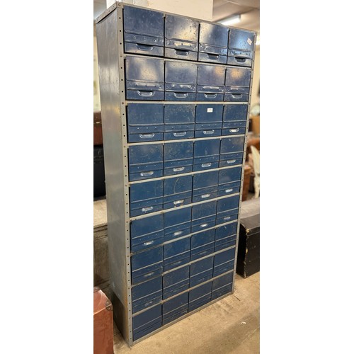 296 - An industrial metal thirty-six drawer cabinet