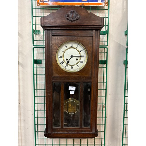 346 - An early 20th Century carved oak wall clock