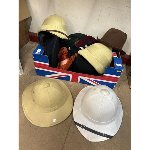 349 - A collection of assorted pith helmets and hats