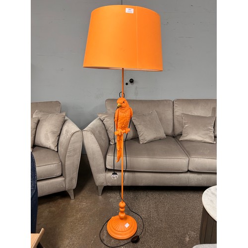 3087 - A floor standing orange lamp in the shape of a parrot