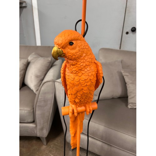 3087 - A floor standing orange lamp in the shape of a parrot