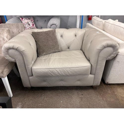 3122 - A stone leather Chesterfield love seat