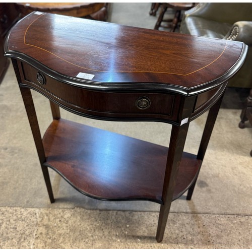 167 - A Regency style mahogany single drawer serpentine hall table