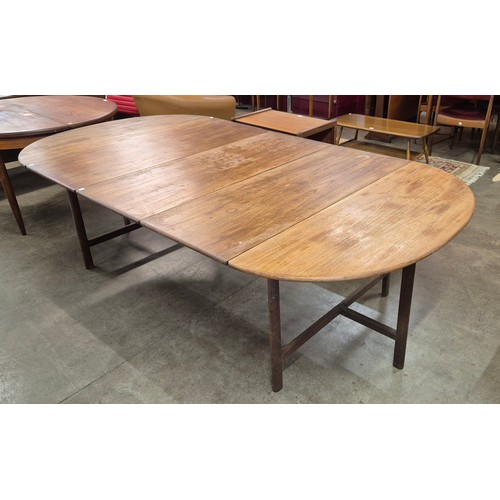 66A - An Archie Shine teak oval extending dining table, designed by Robert Heritage