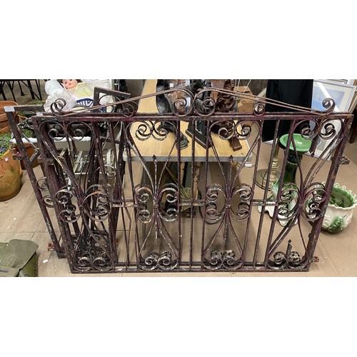 388 - A pair of wrought iron gates and posts