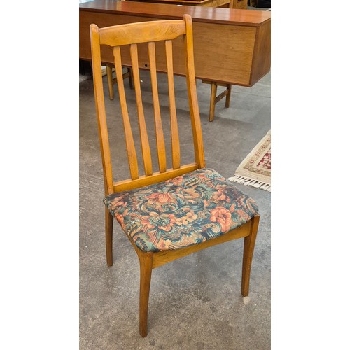 10 - A set of four Danish teak dining chairs