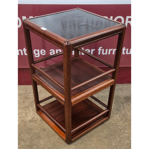 18 - A Danish simulated rosewood revolving cocktail table