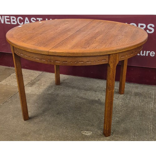 19 - A Danish teak extending dining table