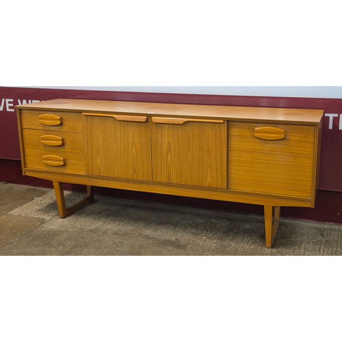 27 - A teak sideboard