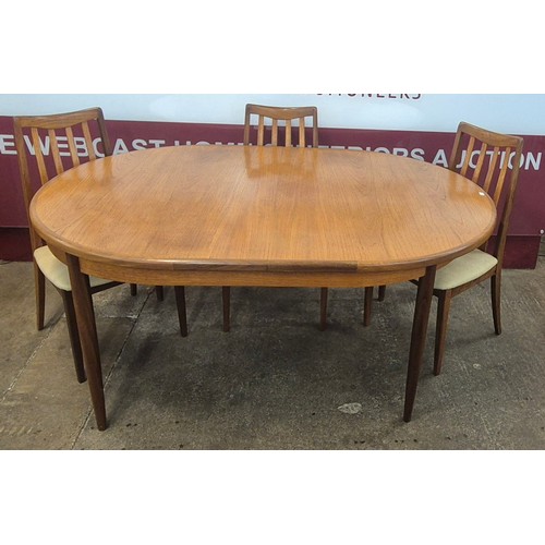 34 - A G-Plan Fresco teak oval extending dining table and three chairs