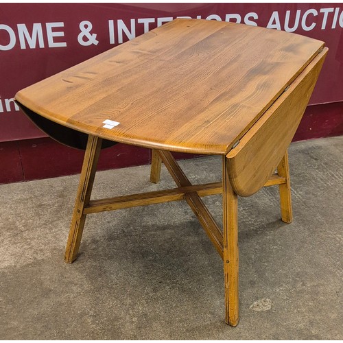 41 - An Ercol Blonde elm Windsor drop-leaf table