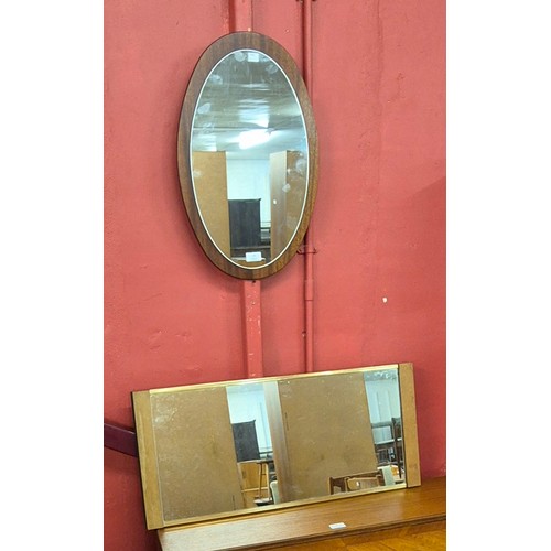 71 - A teak framed oval mirror and one other