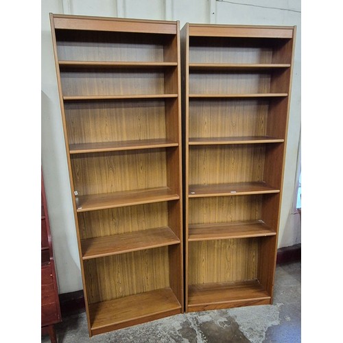 77 - A pair of tall Danish open bookcases