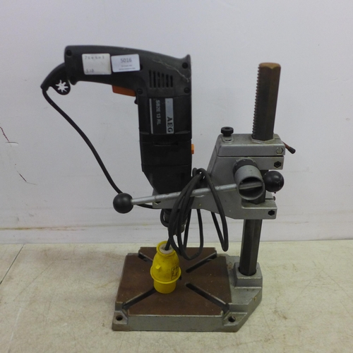 5016 - A quantity of power tools including an AEG SBZA 12RL power drill with a Wolfcraft drill press, a Bos... 