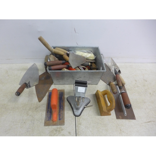 5017 - A large quantity of assorted trowels including, plastering and finishing trowels, gauging trowels, b... 