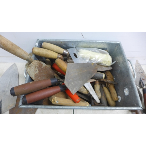 5017 - A large quantity of assorted trowels including, plastering and finishing trowels, gauging trowels, b... 