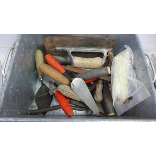 5017 - A large quantity of assorted trowels including, plastering and finishing trowels, gauging trowels, b... 