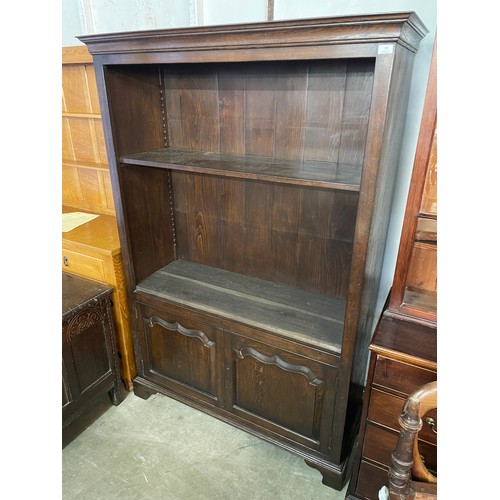 157 - A George III style oak two door bookcase