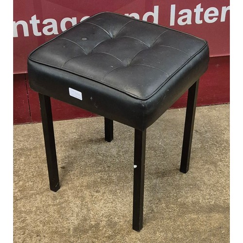 50Z - A black leather footstool