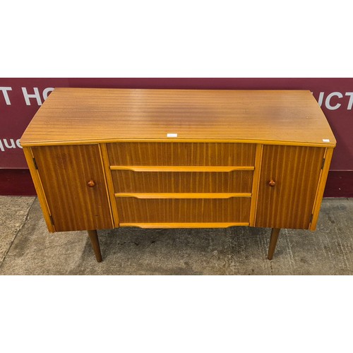 50U - A teak concave sideboard