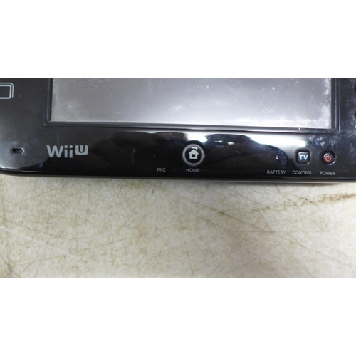 5052 - A Nintendo Wii U console with handheld Nintendo Wii U remote, one other Nintendo remote with nunchuc... 