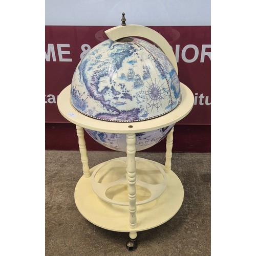 83 - An Italian style terrestrial globe cocktail cabinet/drinks trolley