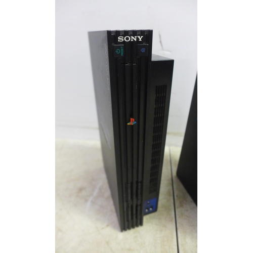 5054 - Two Playstation 2 consoles including power cables etc.